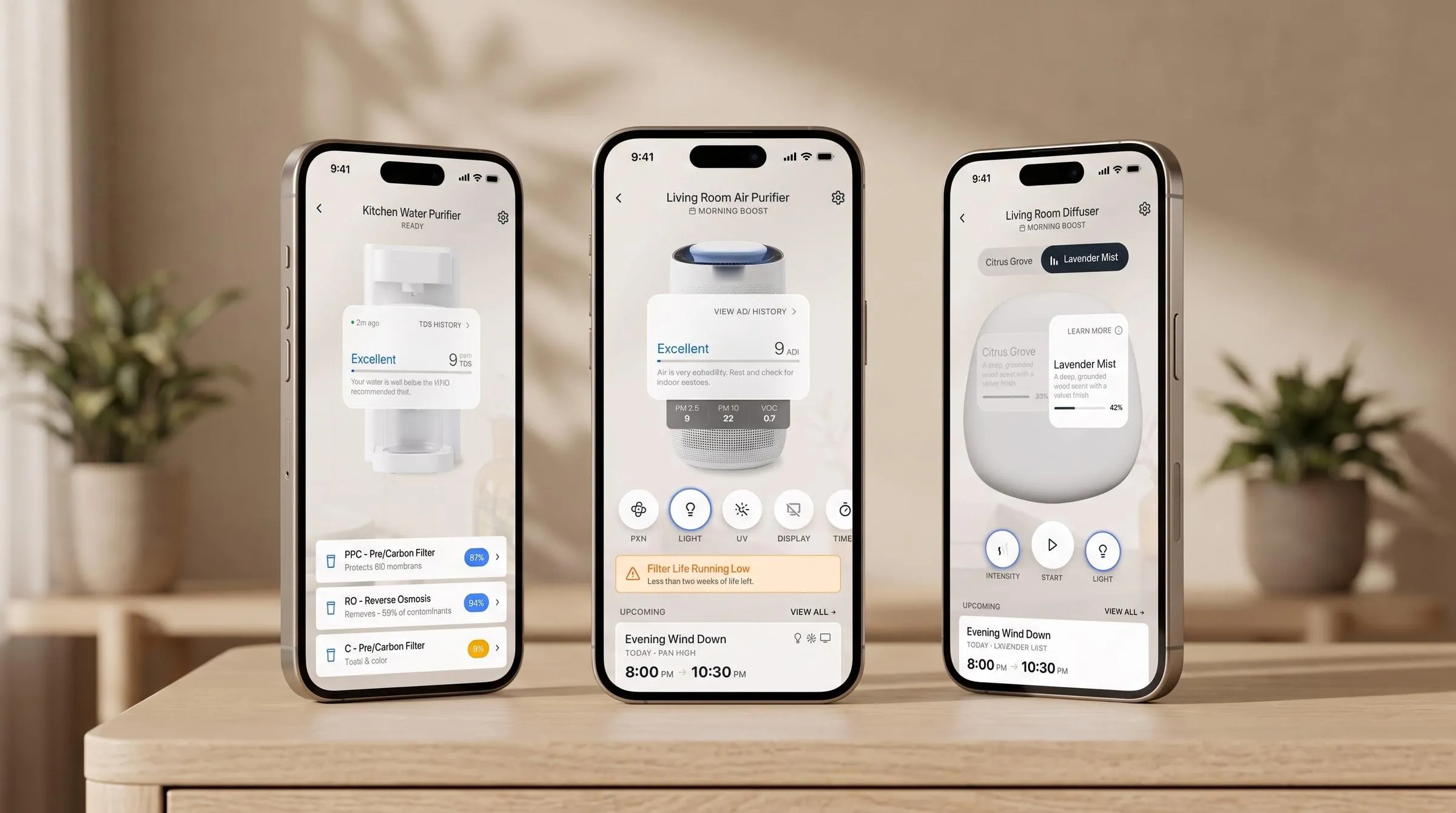 Three phones standing on a sideboard. A water purifier screen listing three filters at eighty-seven, ninety-four and nine per cent, an air purifier screen reading nine on the air quality index above a filter-life warning, and a diffuser screen with two scent pods named along the top.